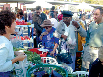 Choosing from the season’s offerings at the Crescent City Farmers Market.